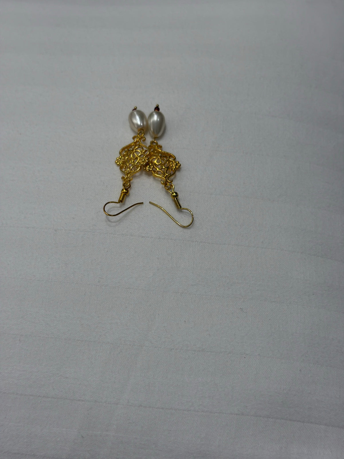 Nomi AM-40 — gold tone