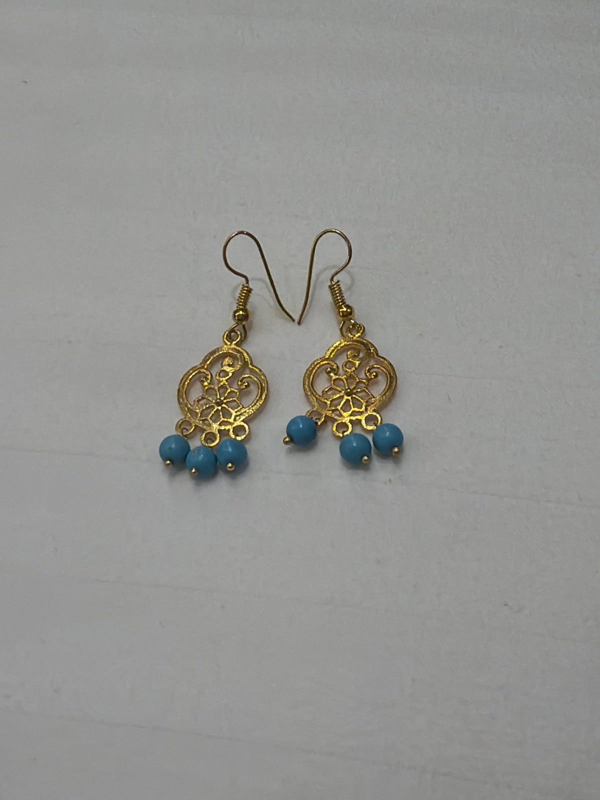 Nomi AM-53 — gold tone