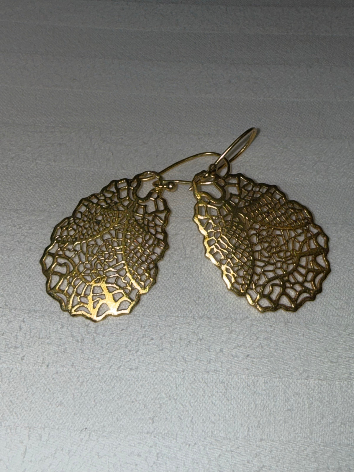Nomi AM-55 — gold tone