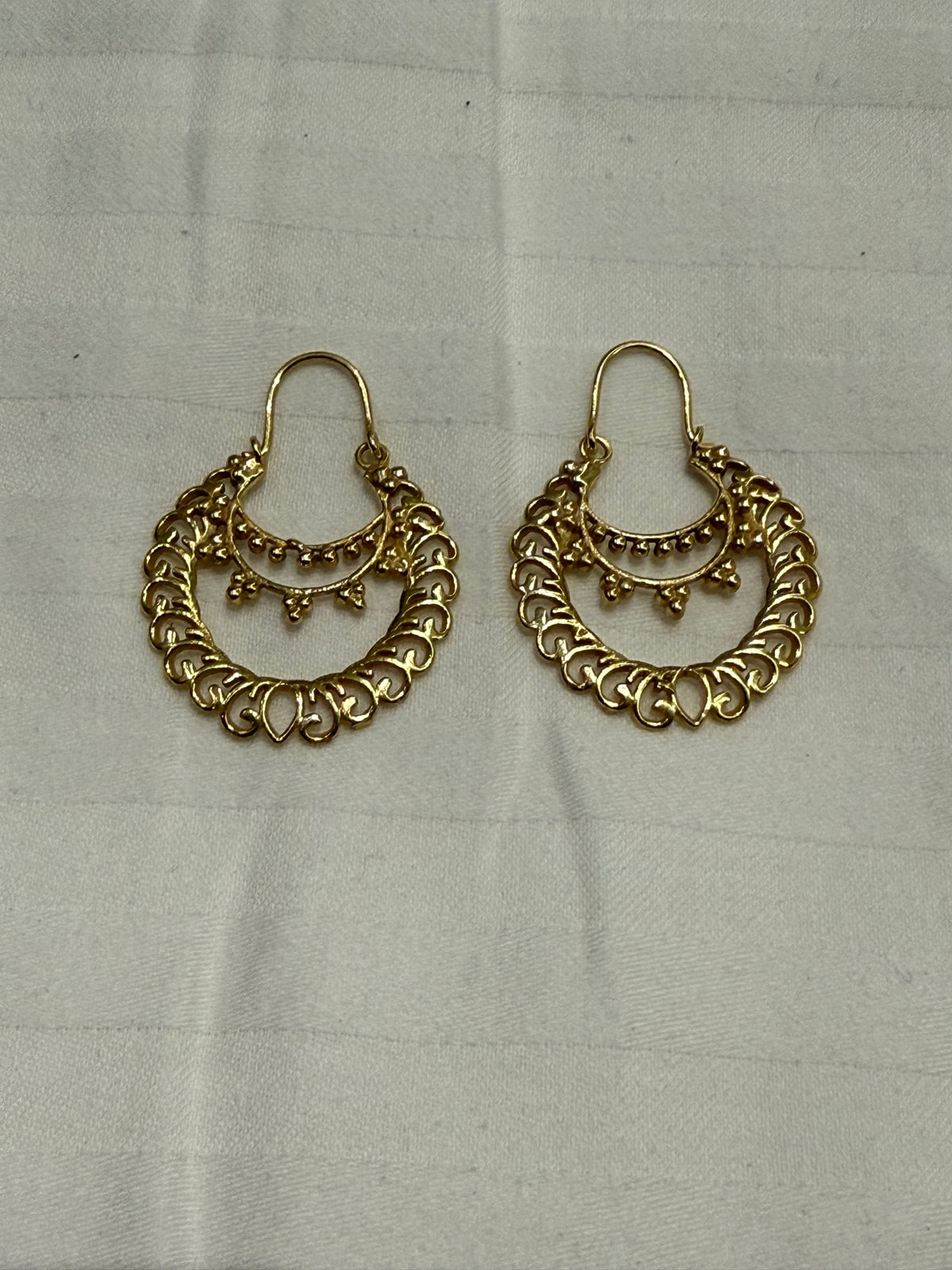 Nomi AM-11 — gold tone