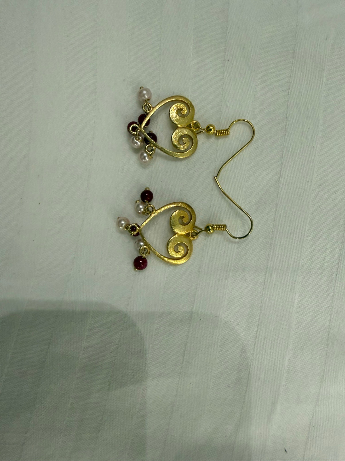 Nomi AM-19 — gold tone