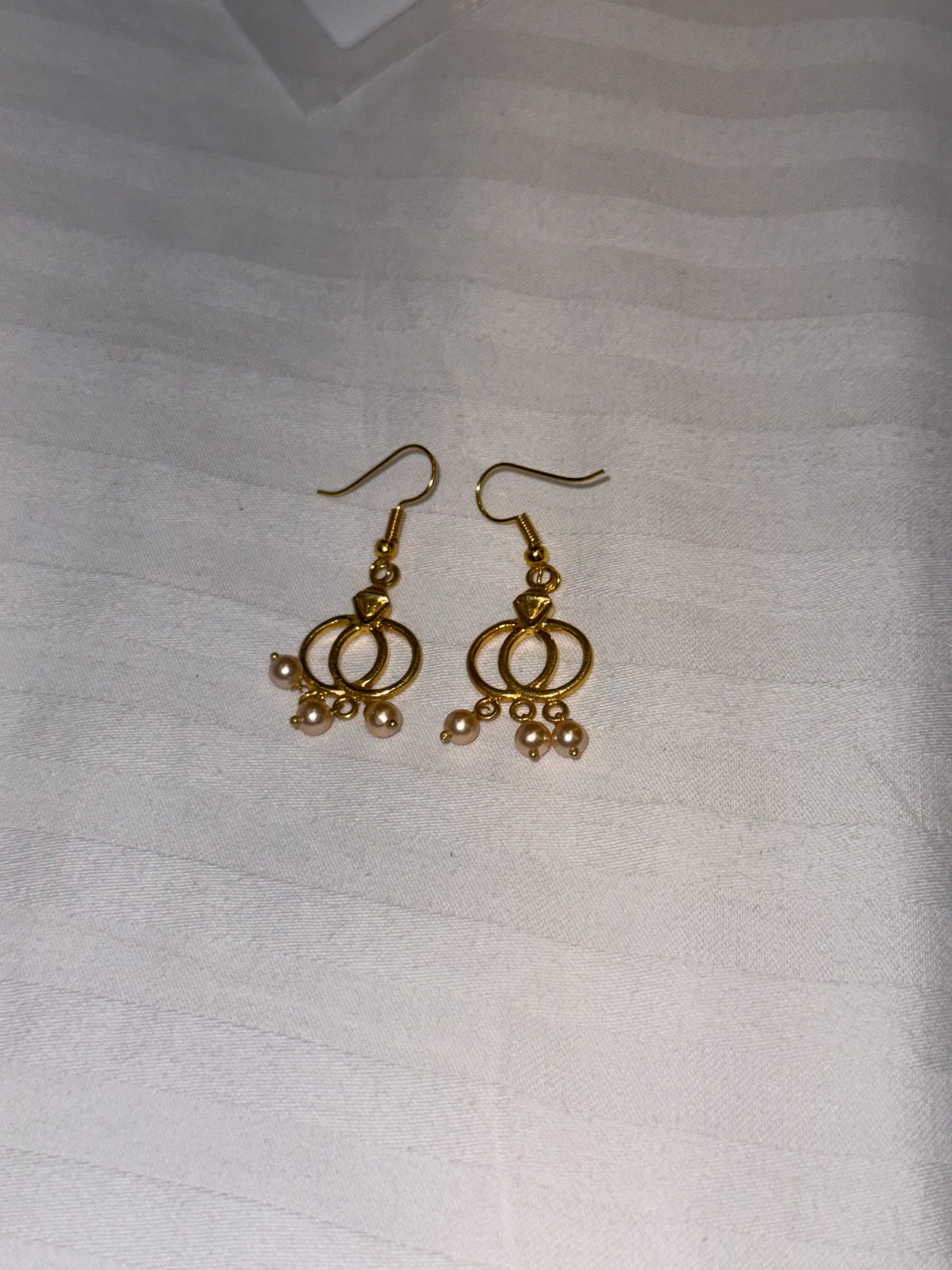 Nomi AM-25 — gold tone