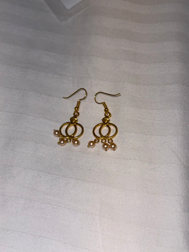 Nomi AM-25 — gold tone