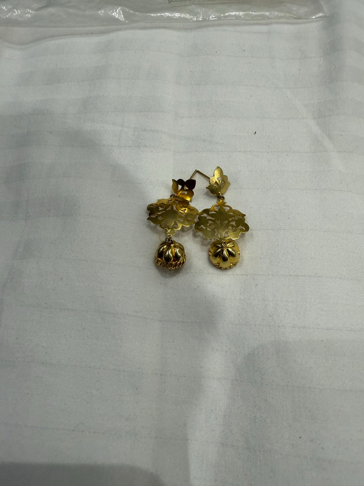 Nomi AM-26 — gold tone