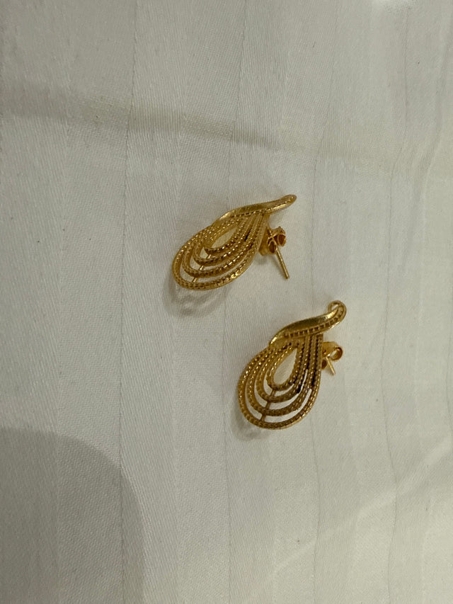 Nomi AM-28 — gold tone