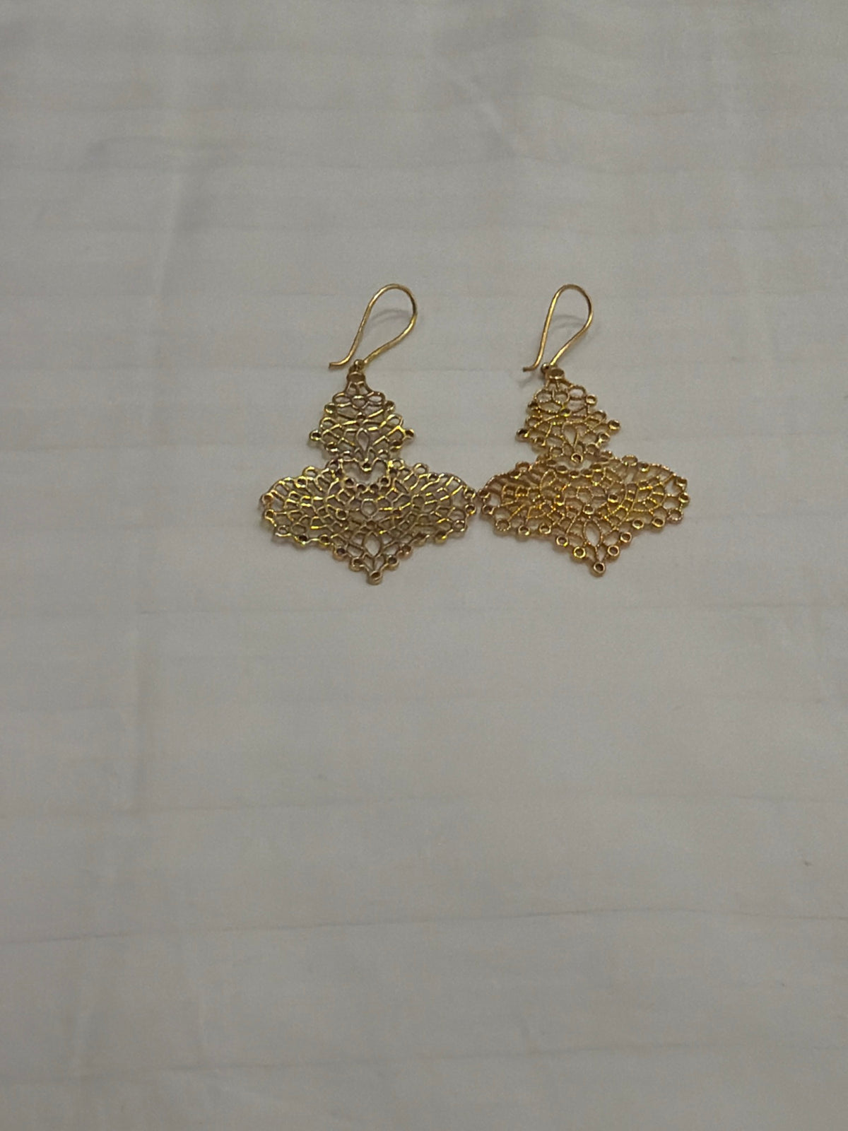 Nomi AM-38 — gold tone