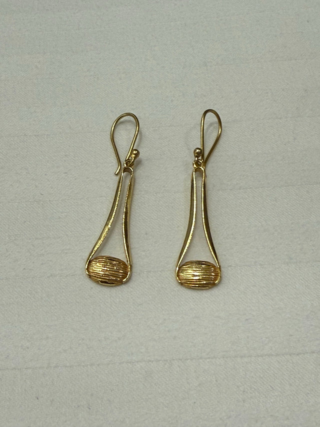 Nomi AM-57 — gold tone