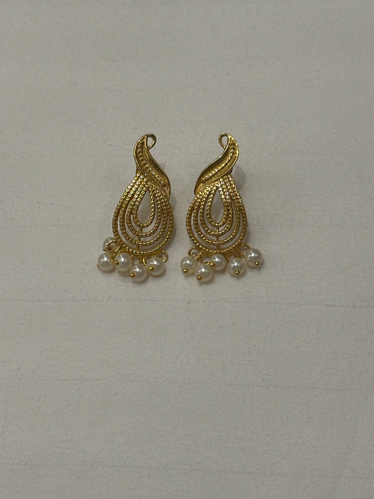 Nomi AM-58 — gold tone