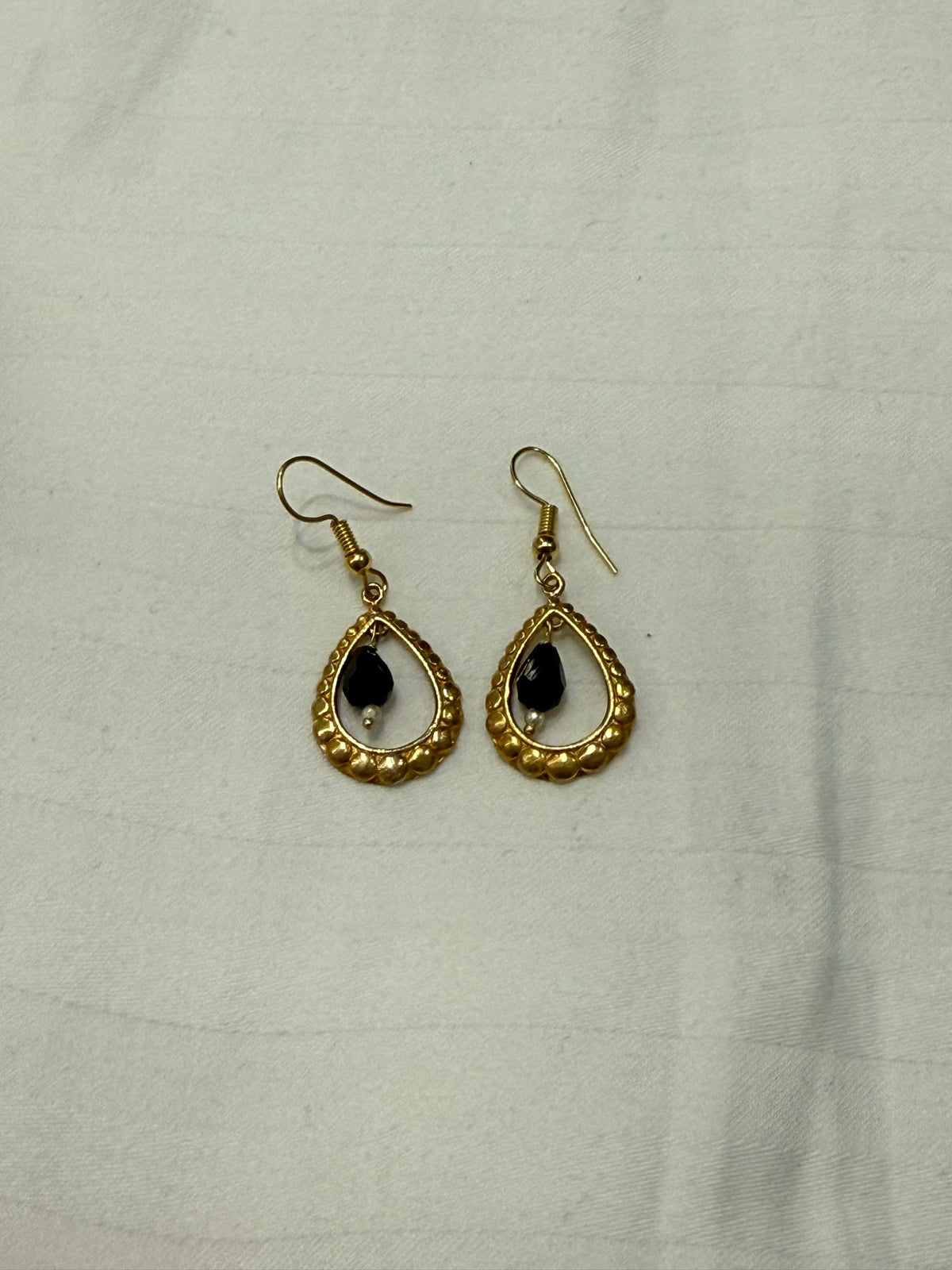 Nomi AM-63 — gold tone