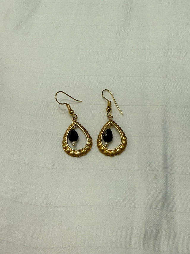Nomi AM-63 — gold tone