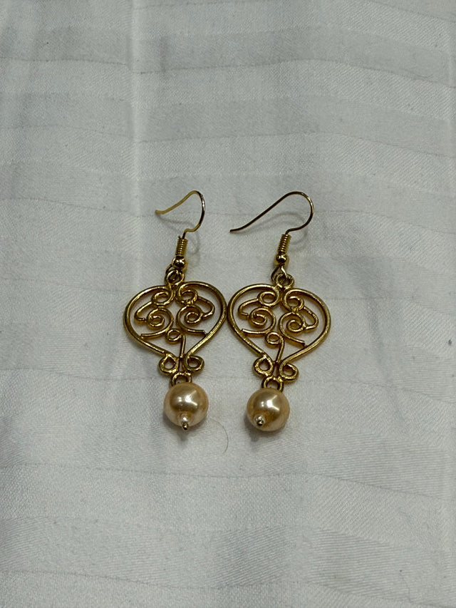 Nomi AM-65 — gold tone